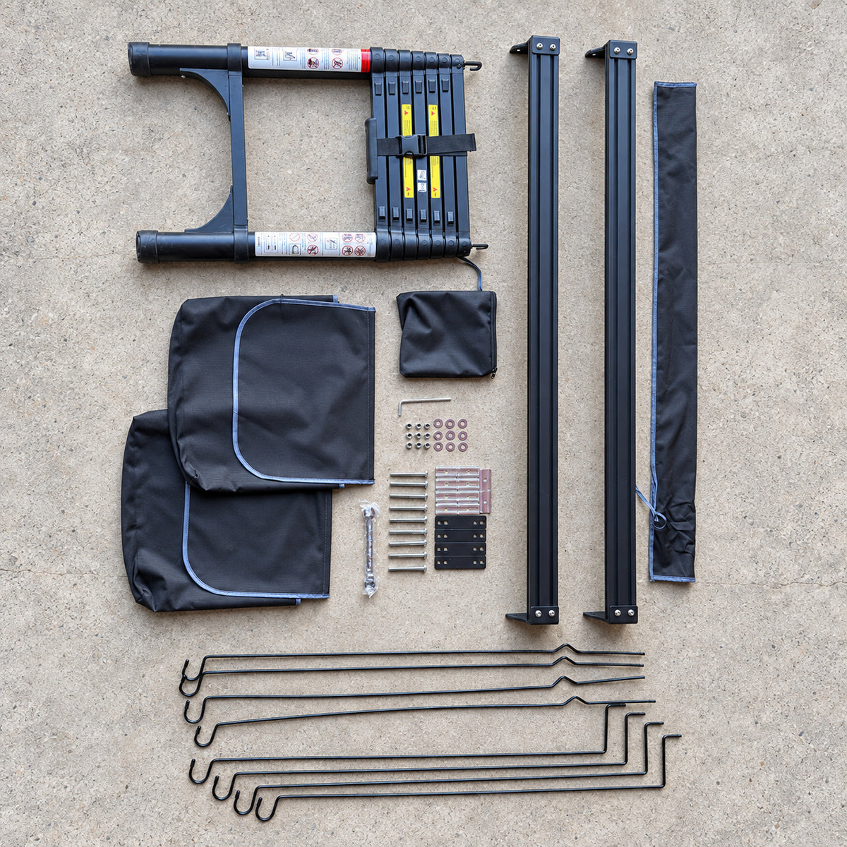 Ladder, rails, bags, poles and fittings photographed with the CZY AIR rooftop tent on clean concrete.