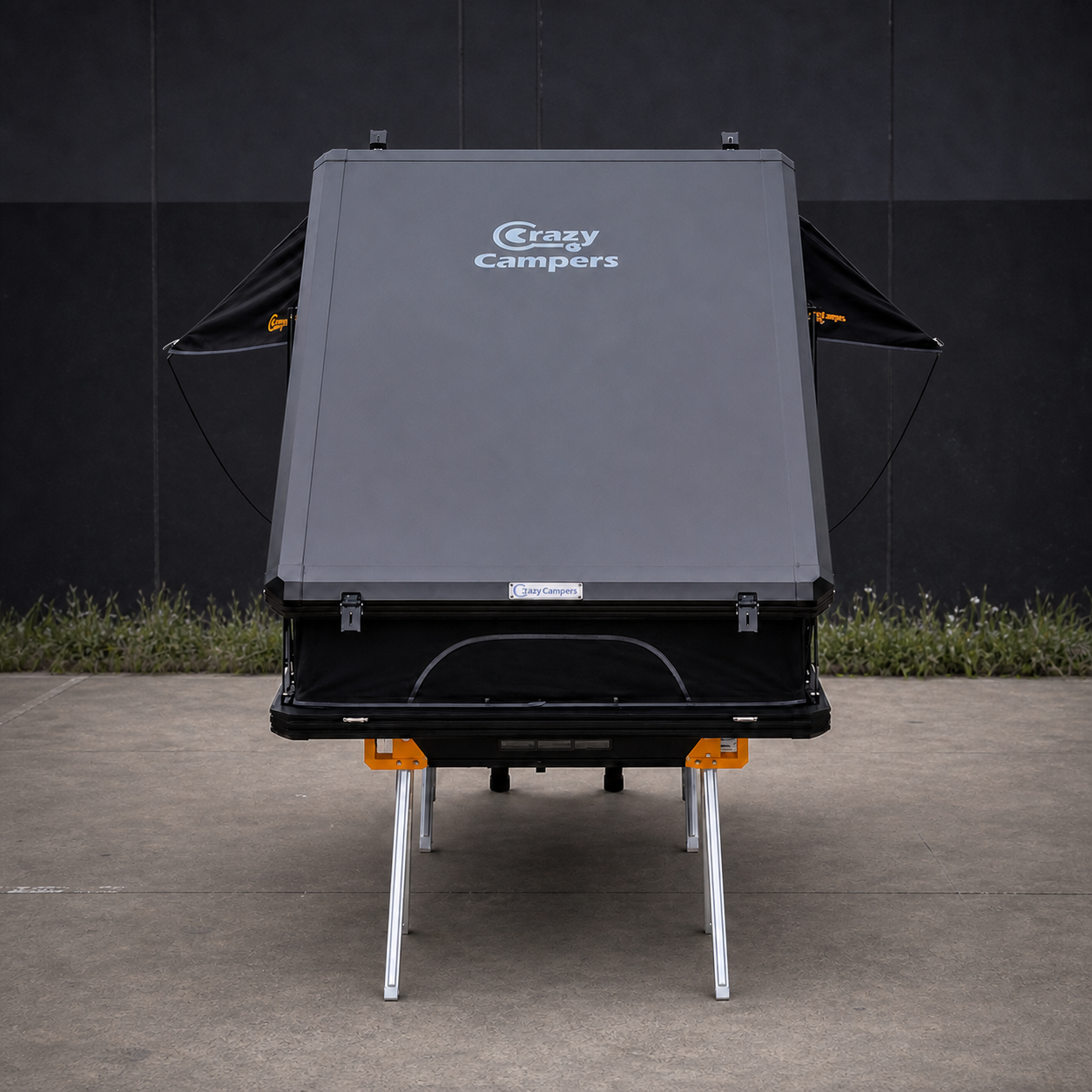 Older Version Overland X 1380 rooftop tent closed on saw horses in the CrazyCampers warehouse