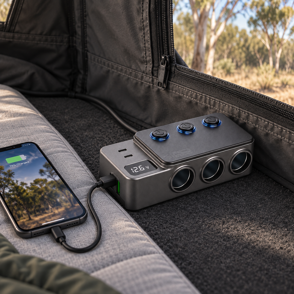 CZY 12V and 24V triple socket power hub charging a phone inside a rooftop tent