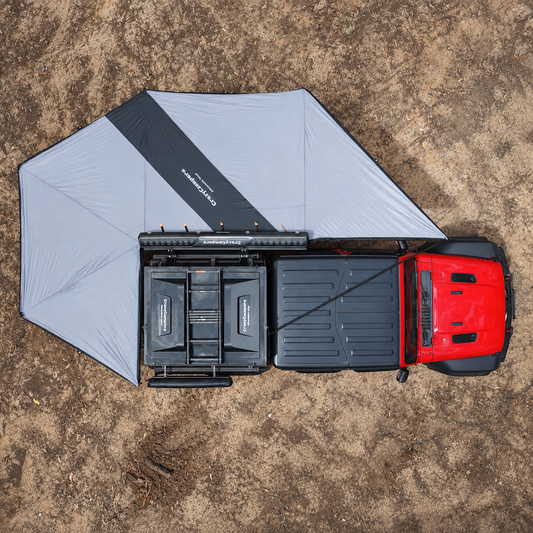Drone view of the Shell 270 Plus awning deployed beside a red Jeep.