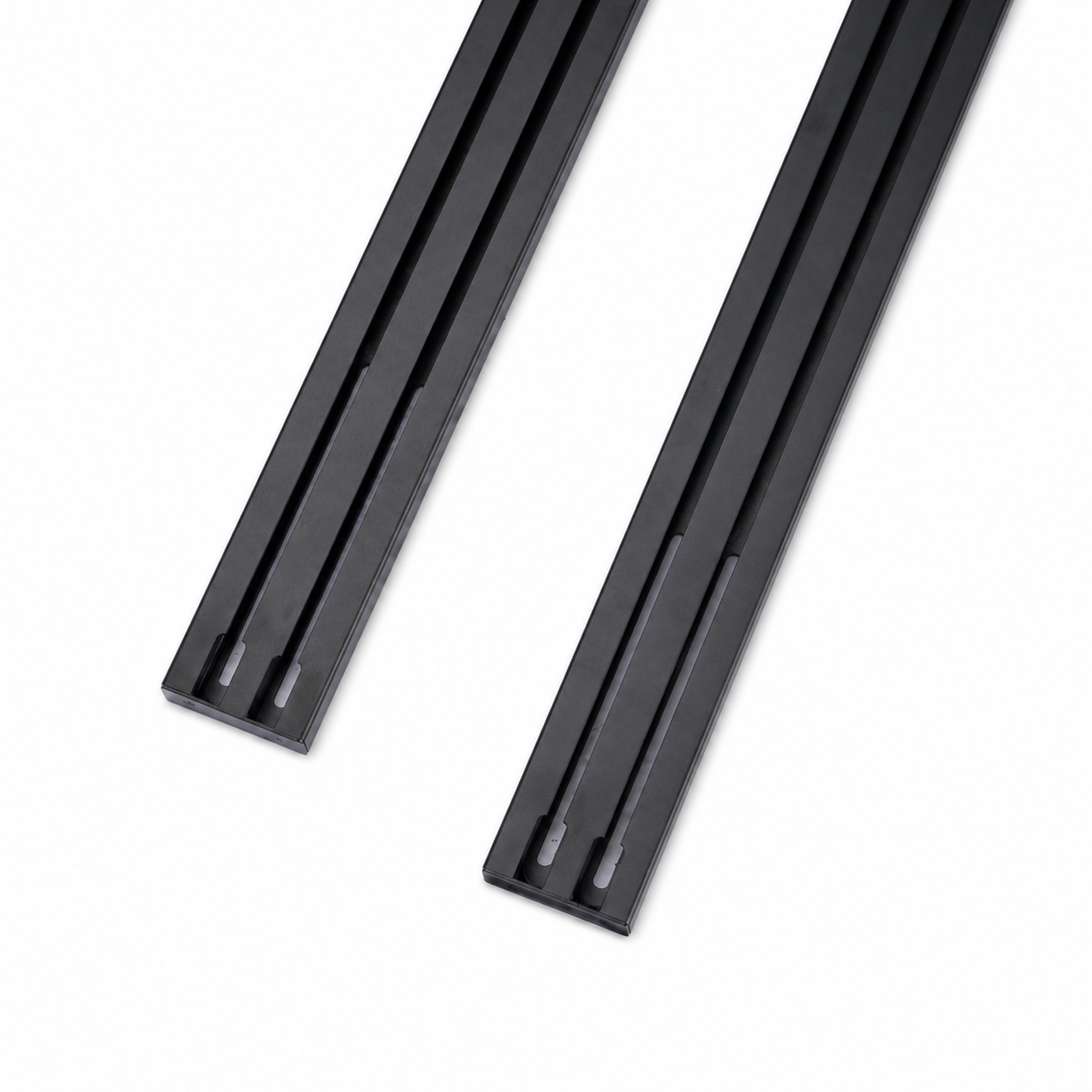 Twin accessory channels on two black 1450 roof rail cross bars
